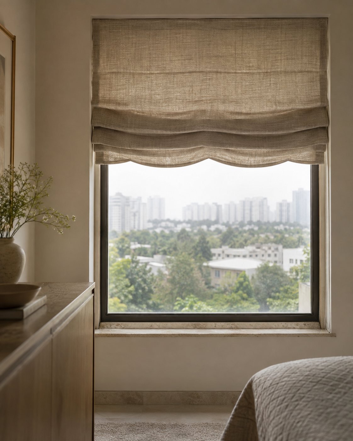 Linen roman blind on a window overlooking greenery